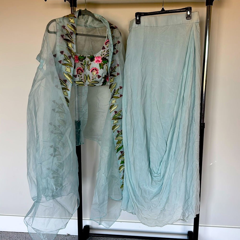 Light blue dule color embroidered draped skirt set with jacket…Indowestern..